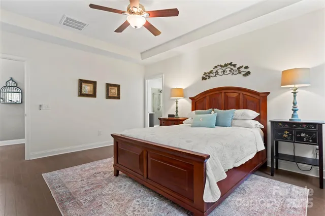 a bed room with a bed and a lamp