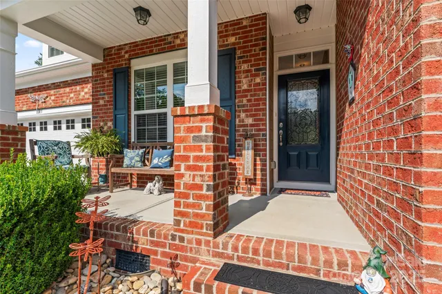 front view of a building with a garden