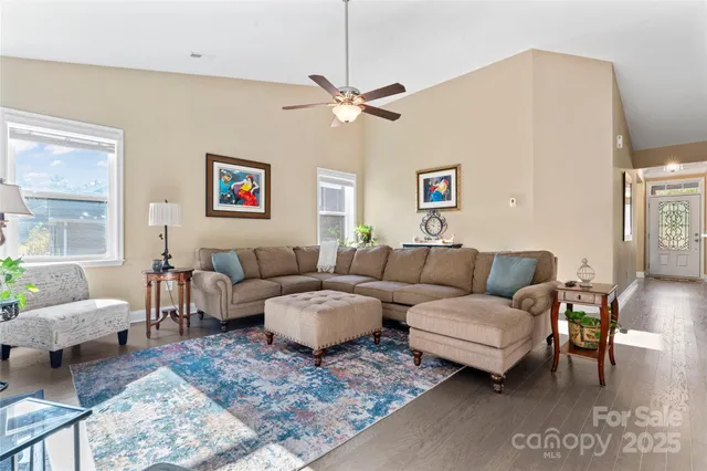a living room with furniture and a rug