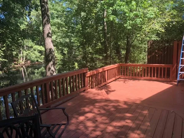 a view of balcony with wooden floor