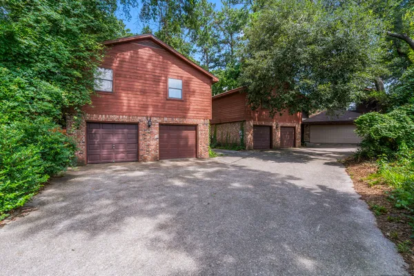 a view of a house with a yard and garage