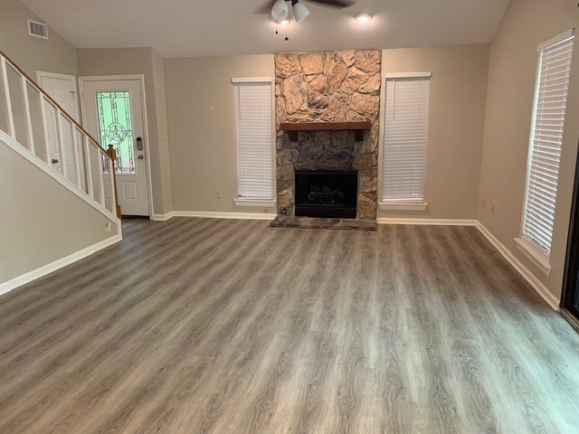 422 Nursery Road Spring, TX 77380 - Photo 4 of 26 a view of an empty room with wooden floor fireplace and a window