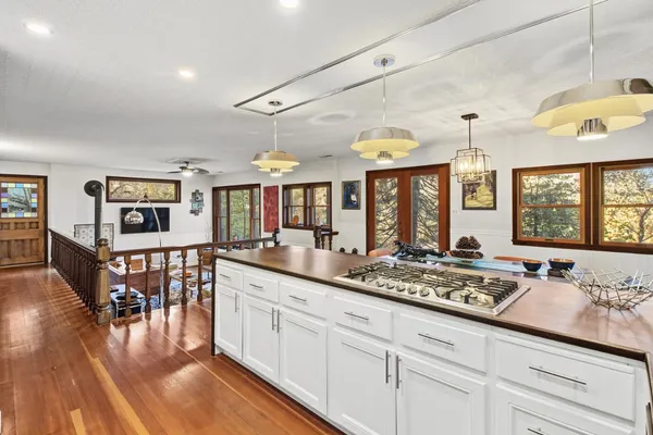 a bathroom with a sink a toilet and a window
