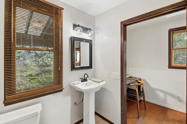 a bathroom with a glass shower door and a shower