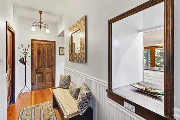 a view of an entryway with wooden floor