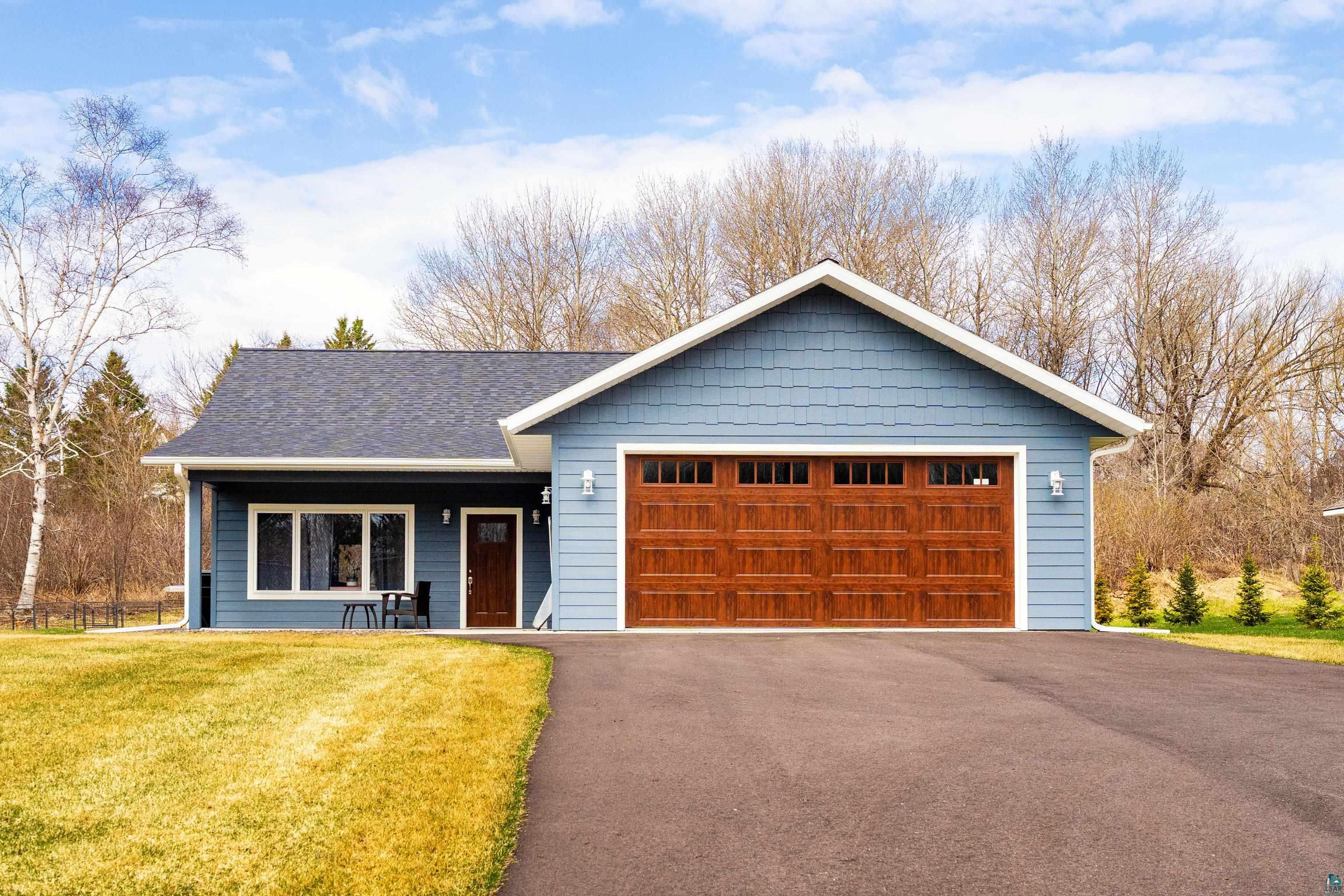 3829 Stebner Road Hermantown, MN 55811 - Photo 1 of 28 Contemporary exterior featuring blue siding with white trim