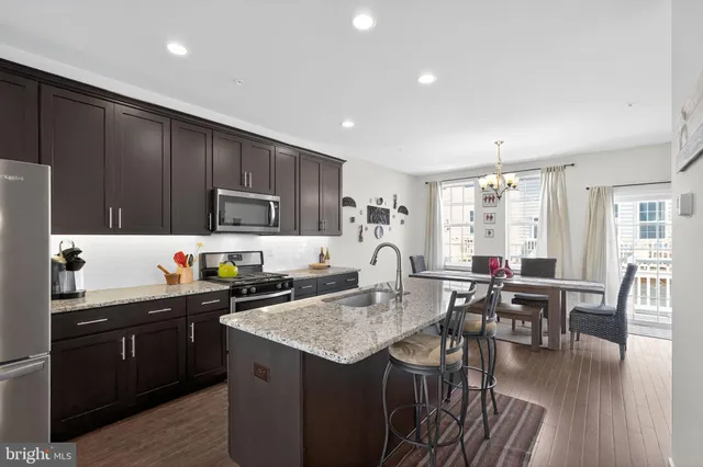 a kitchen with granite countertop lots of counter top space and dining table