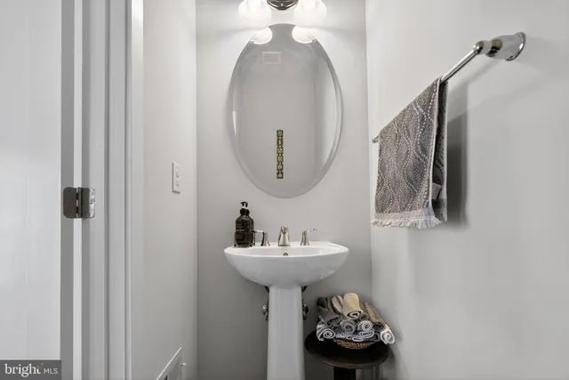 a bathroom with a sink and mirror