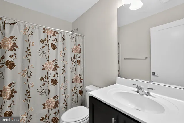 a bathroom with a sink and toilet