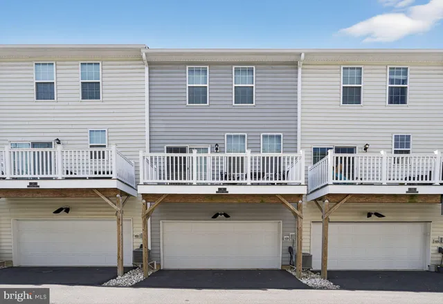 a front view of a house with a garage