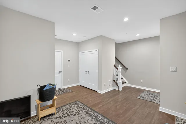 a view of entryway with wooden floor