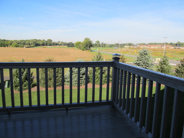 983 Kelly Lane, Unit 983 Sycamore, IL 60178 - Photo 3 of 25 a balcony with outdoor space and lake view
