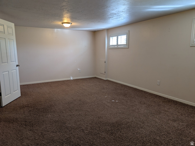 1411 Millbrook Way Bountiful, UT 84010 - Photo 30 of 36 Large multipurpose room with neutral wall tones and white baseboards