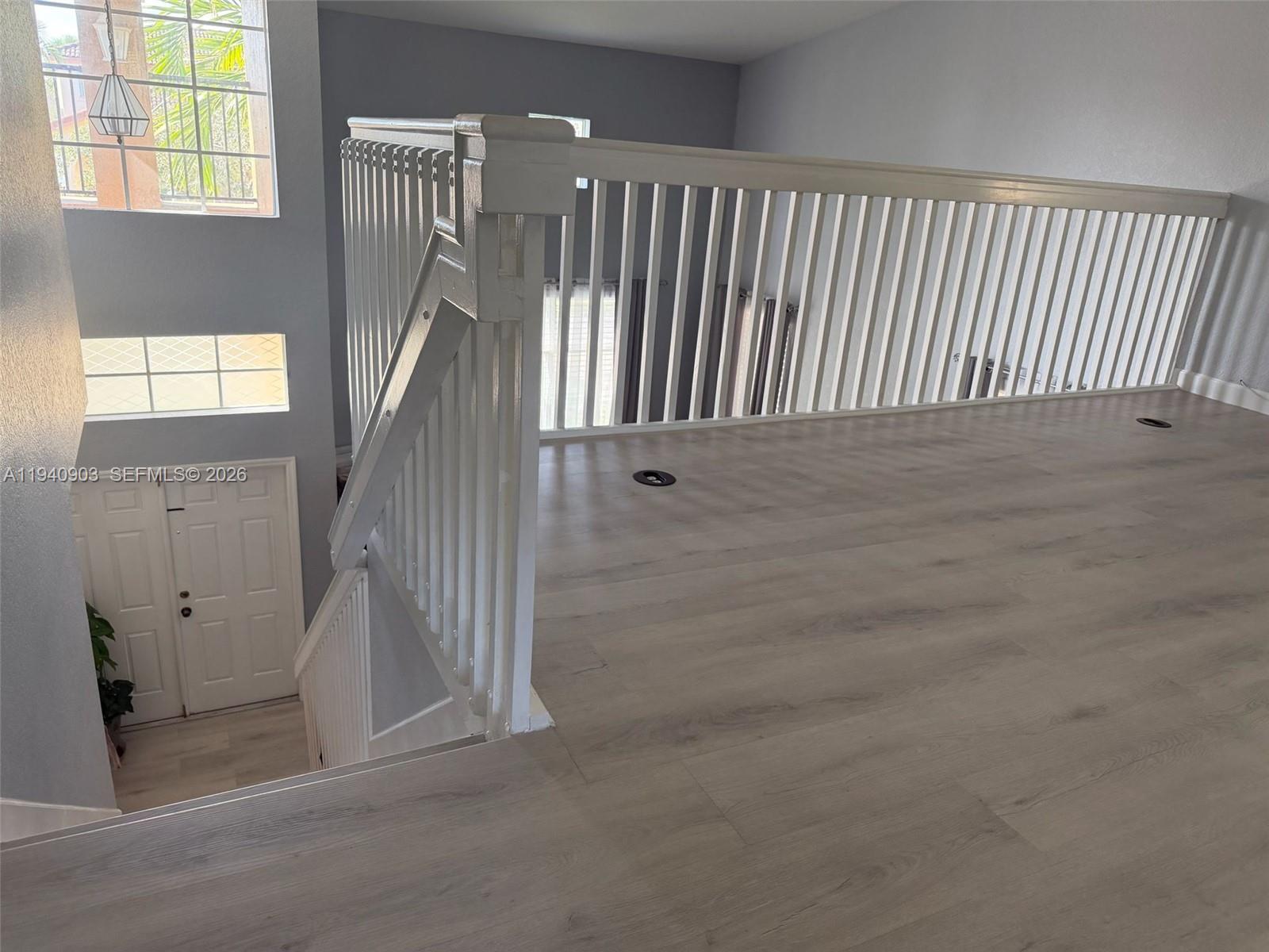 22547 Southwest 94th Path, Unit 22547 Cutler Bay, FL 33190 - Photo 13 of 20 a view of entryway with wooden floor