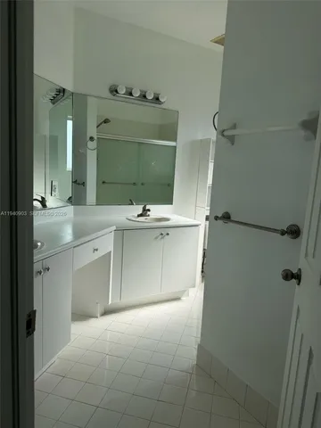 a bathroom with a sink vanity and toilet