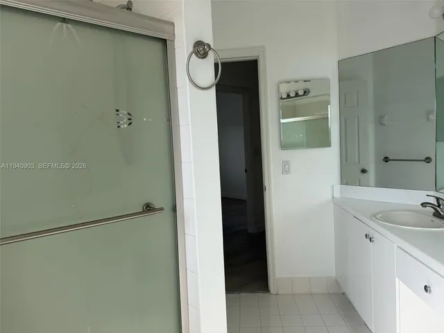 a bathroom with a sink and shower