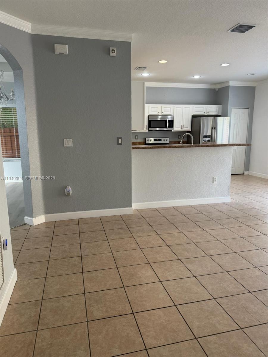 22547 Southwest 94th Path, Unit 22547 Cutler Bay, FL 33190 - Photo 4 of 20 a view of a kitchen with a sink and cabinets