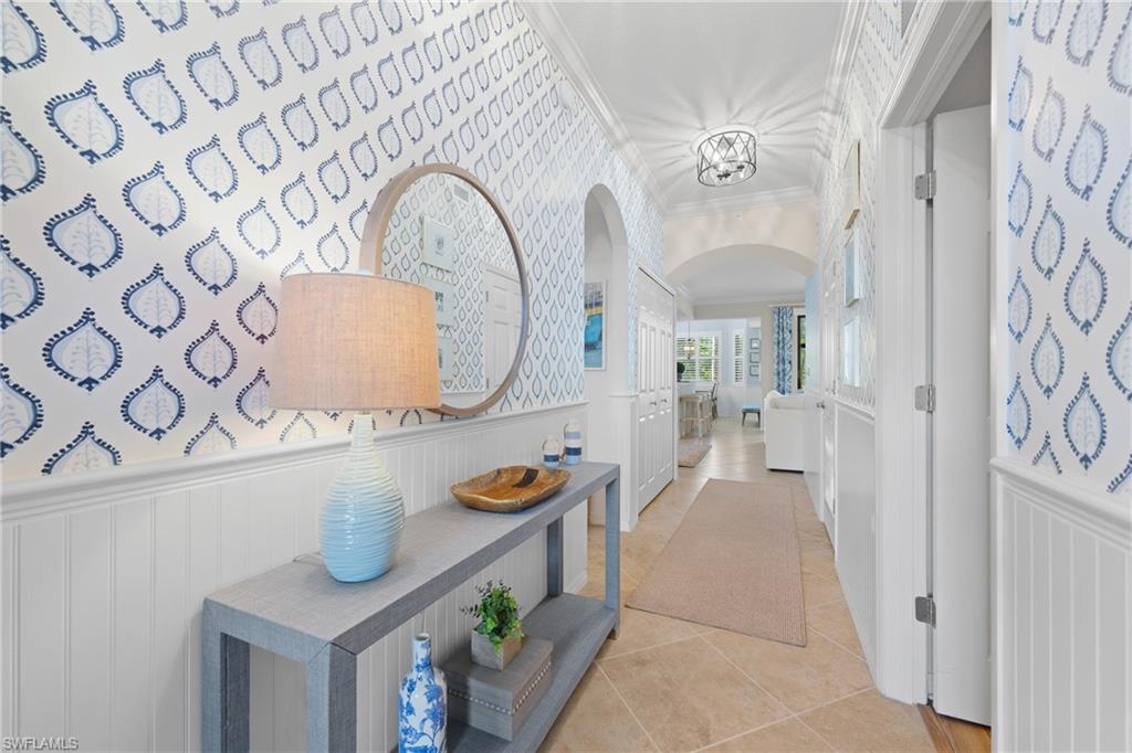 9715 Acqua Court, Unit 116 Naples, FL 34113 - Photo 2 of 43 a spacious bathroom with a granite countertop sink and a mirror