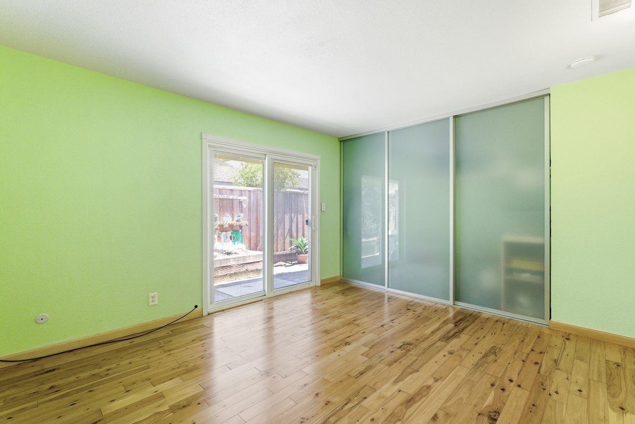5561 Roundtree Common Fremont, CA 94538 - Photo 15 of 29 a view of a room with wooden floor and a bathroom