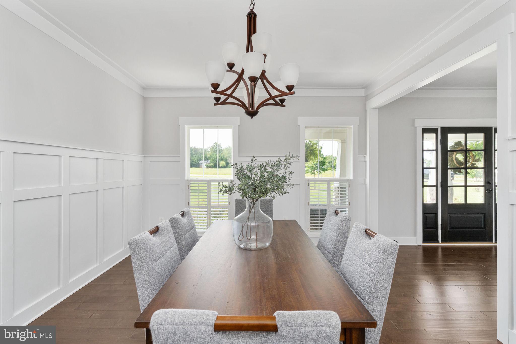 115 Saddle Ridge Lane Fredericksburg, VA 22406 - Photo 20 of 100 a view of a dining room with furniture wooden floor and chandelier