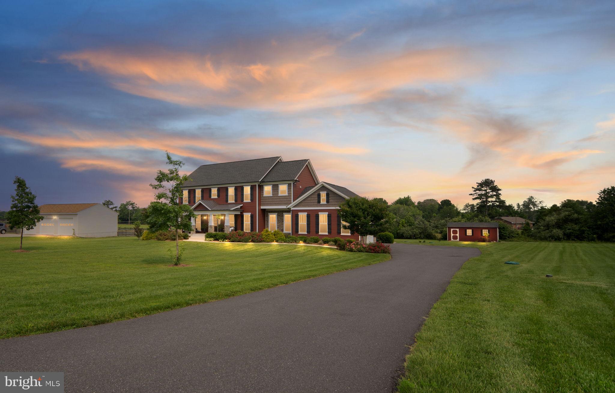 115 Saddle Ridge Lane Fredericksburg, VA 22406 - Photo 4 of 100 a view of a big house with a big yard and a large trees