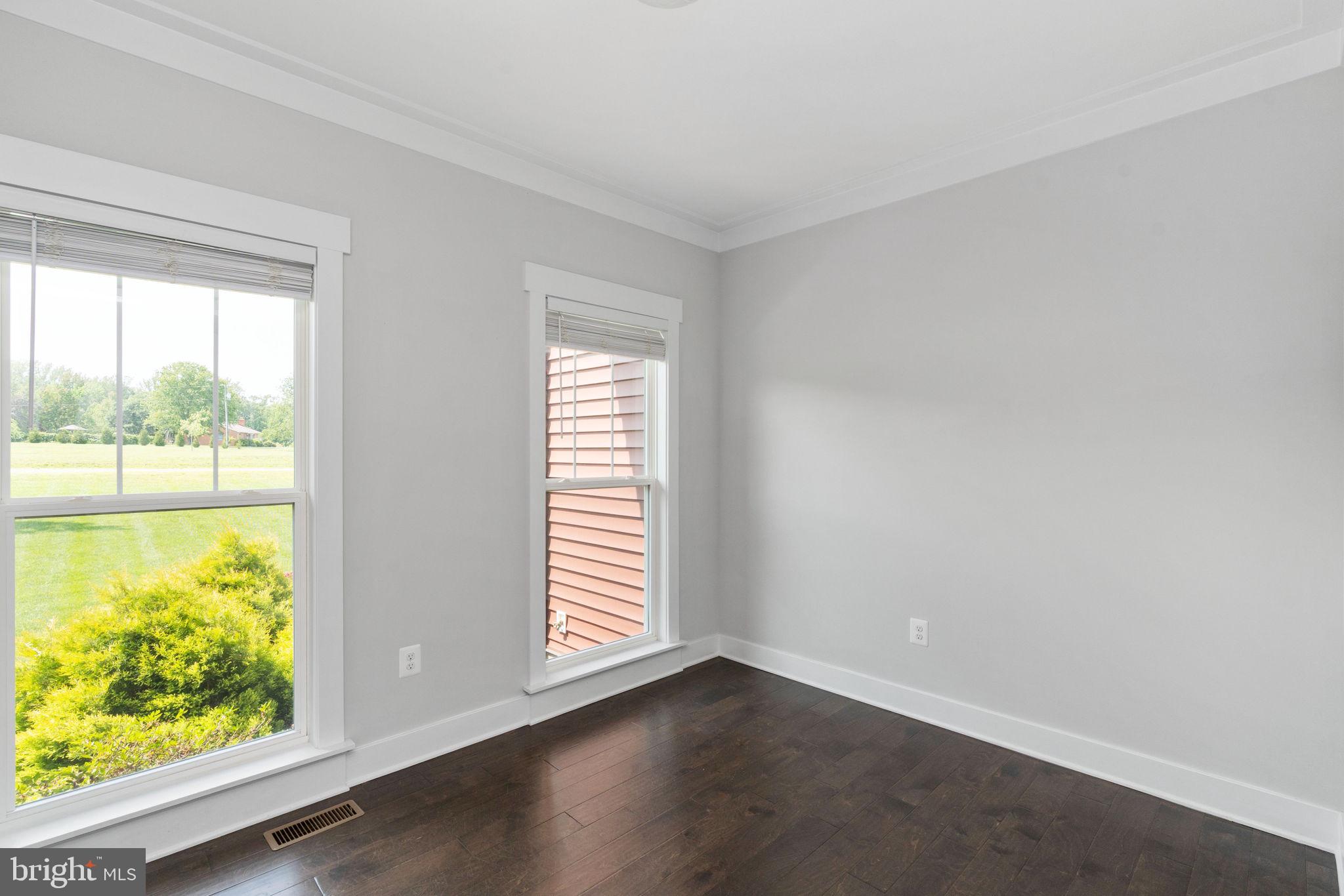 115 Saddle Ridge Lane Fredericksburg, VA 22406 - Photo 44 of 100 an empty room with wooden floor and windows
