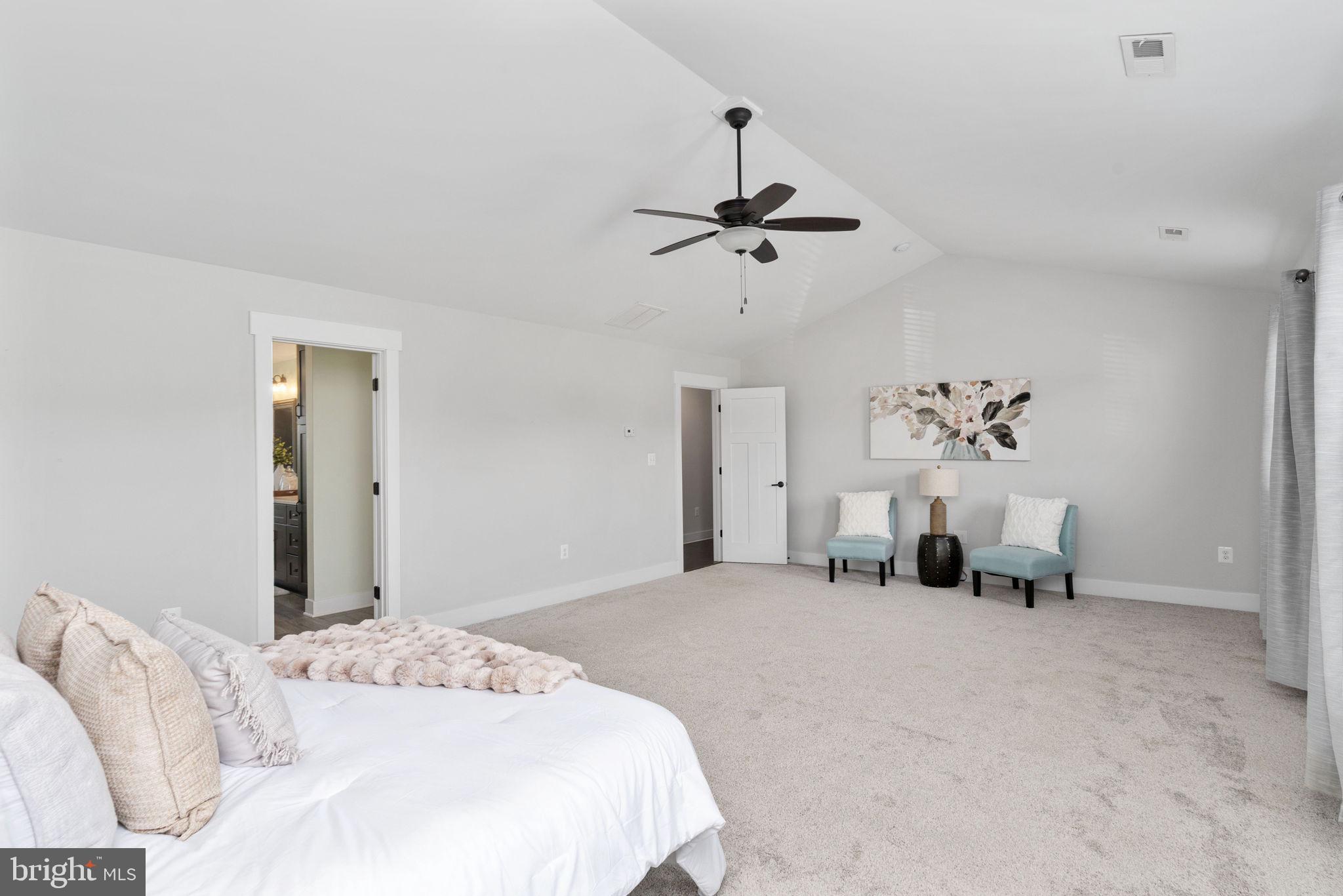 115 Saddle Ridge Lane Fredericksburg, VA 22406 - Photo 52 of 100 a bedroom with a bed and a chandelier