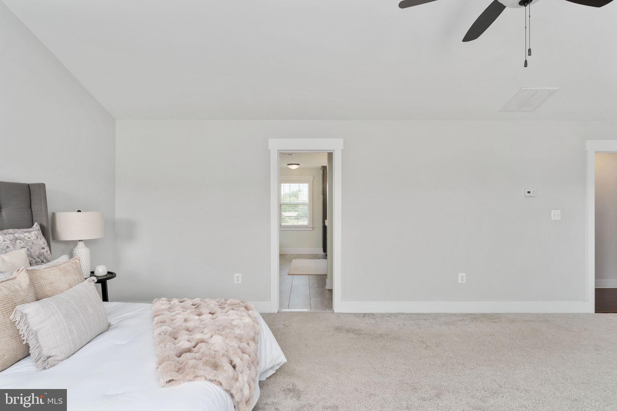115 Saddle Ridge Lane Fredericksburg, VA 22406 - Photo 53 of 100 a bedroom with a bed and a chandelier