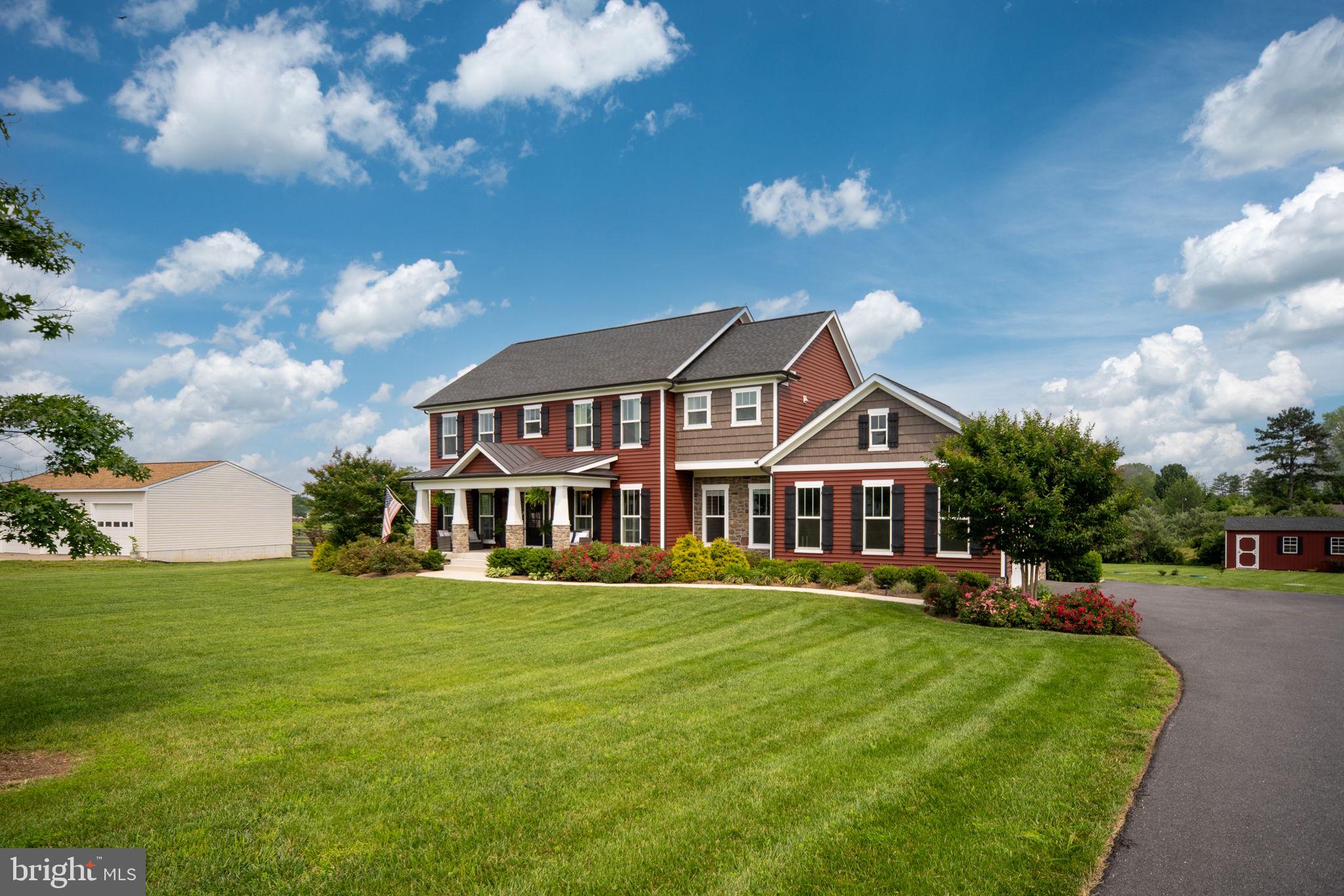 115 Saddle Ridge Lane Fredericksburg, VA 22406 - Photo 6 of 100 a front view of a house with a yard table and chairs