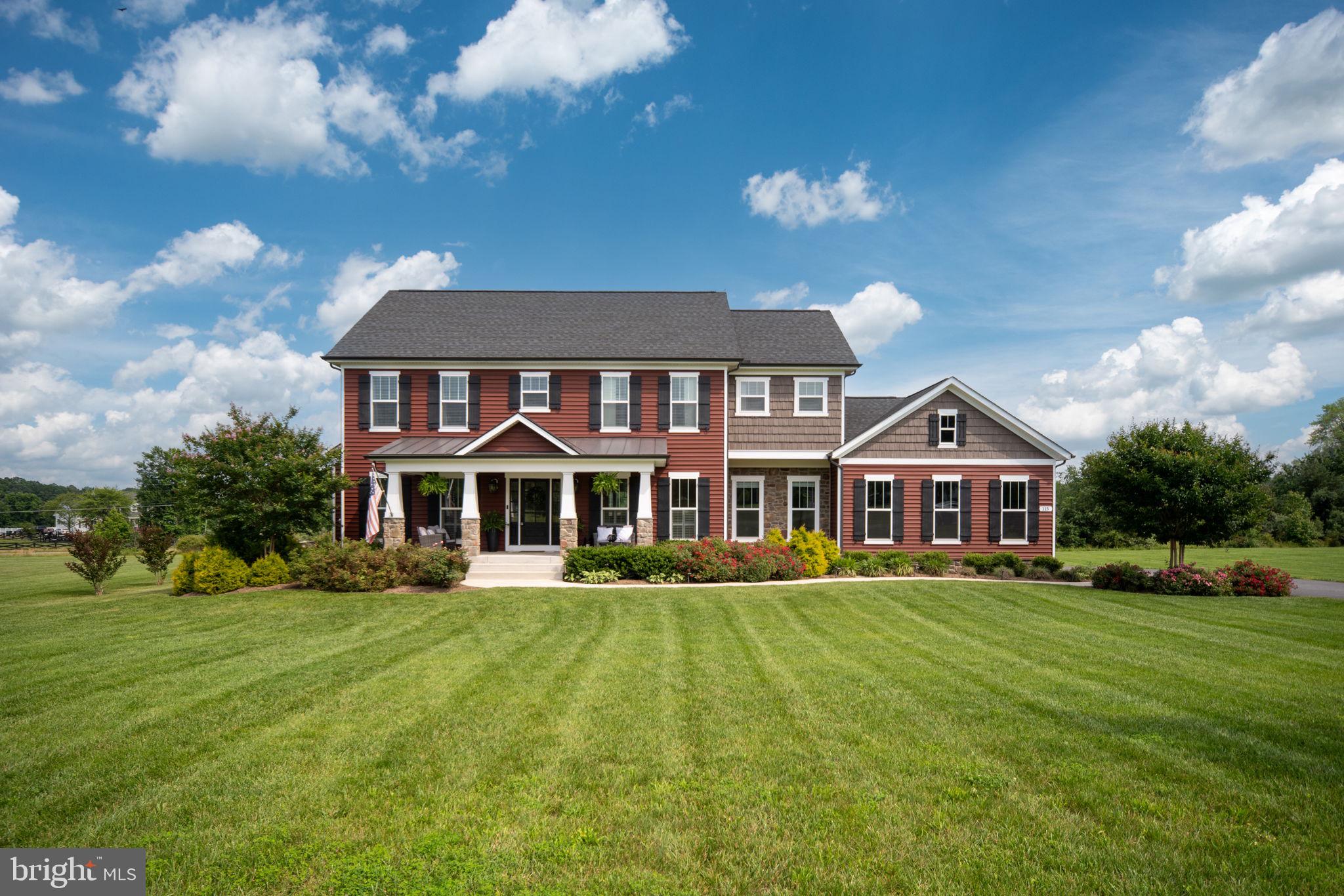 115 Saddle Ridge Lane Fredericksburg, VA 22406 - Photo 7 of 100 a front view of a house with a yard