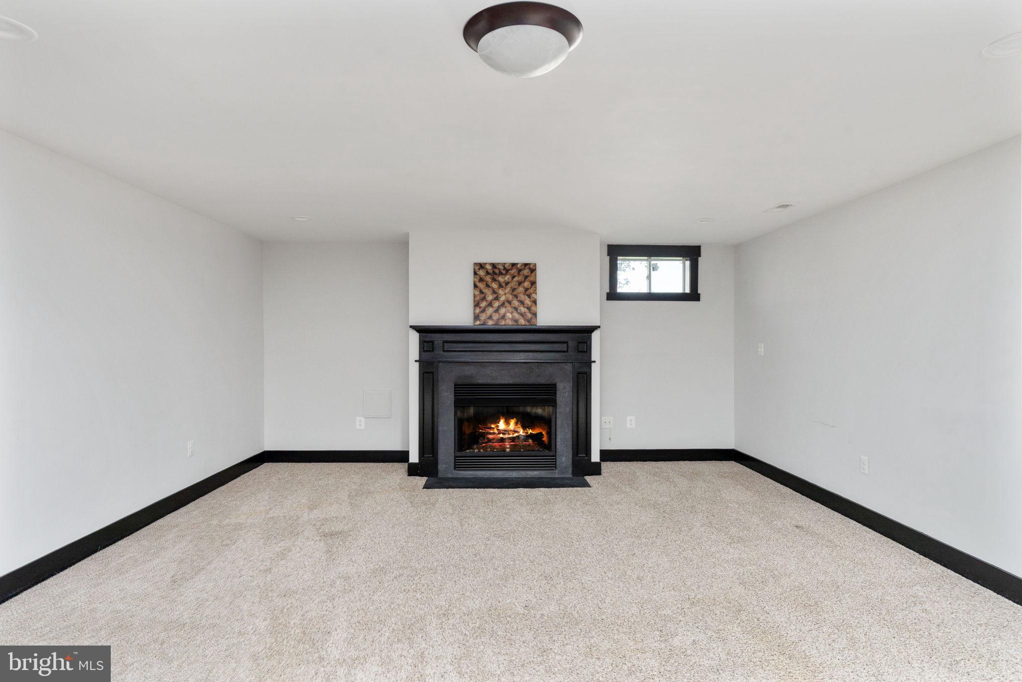 115 Saddle Ridge Lane Fredericksburg, VA 22406 - Photo 76 of 100 a view of an empty room with window and fire place