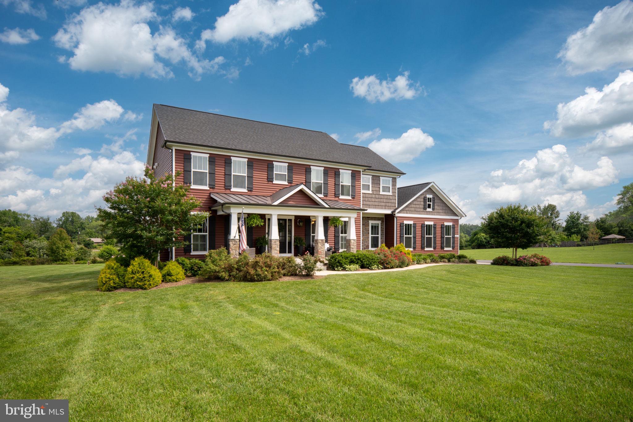 115 Saddle Ridge Lane Fredericksburg, VA 22406 - Photo 8 of 100 a front view of a house with a yard