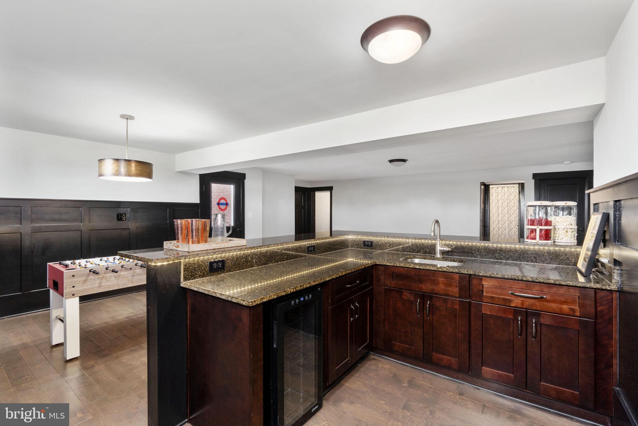 115 Saddle Ridge Lane Fredericksburg, VA 22406 - Photo 81 of 100 a kitchen with a sink and a stove with wooden cabinets
