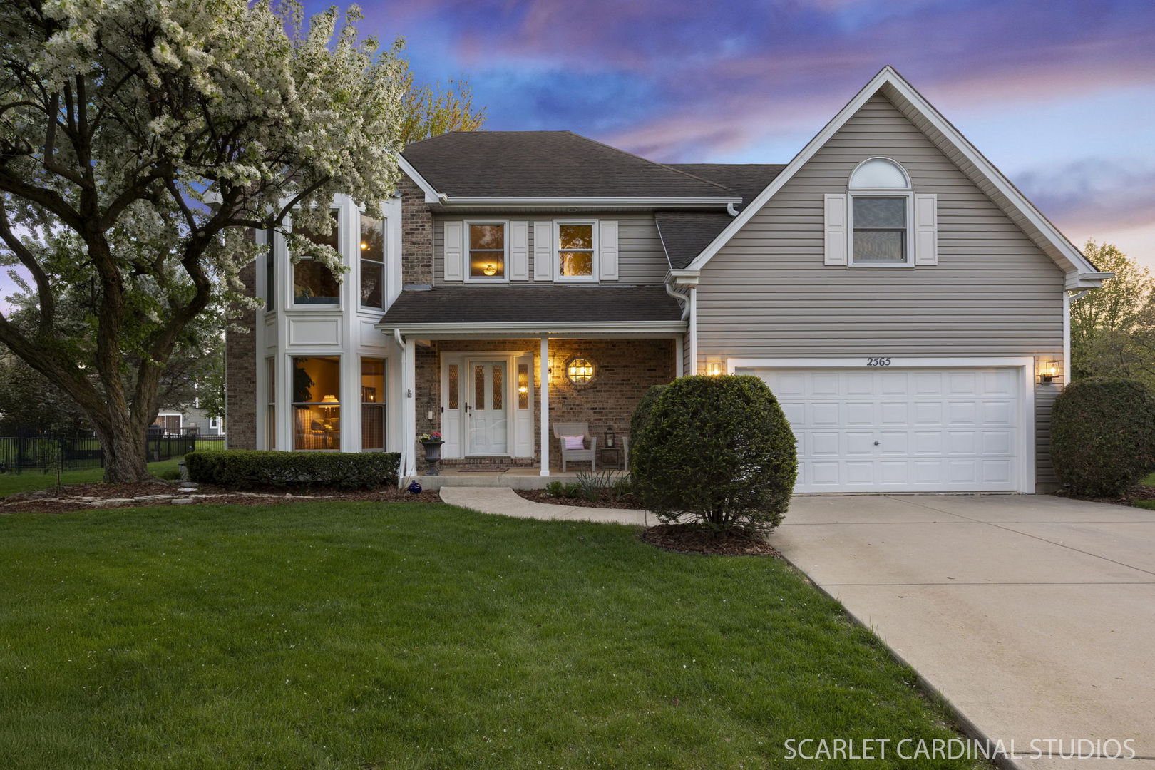 2565 Thornley Court Aurora, IL 60504 - Photo 1 of 59 a front view of a house with a yard and garage