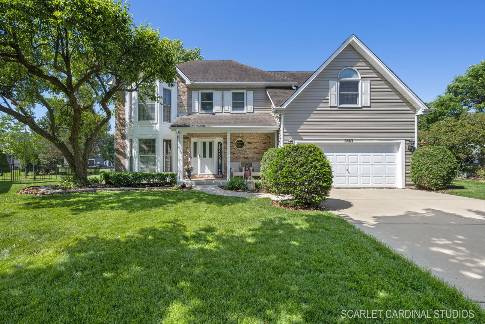 2565 Thornley Court Aurora, IL 60504 - Photo 5 of 59 a front view of a house with a yard