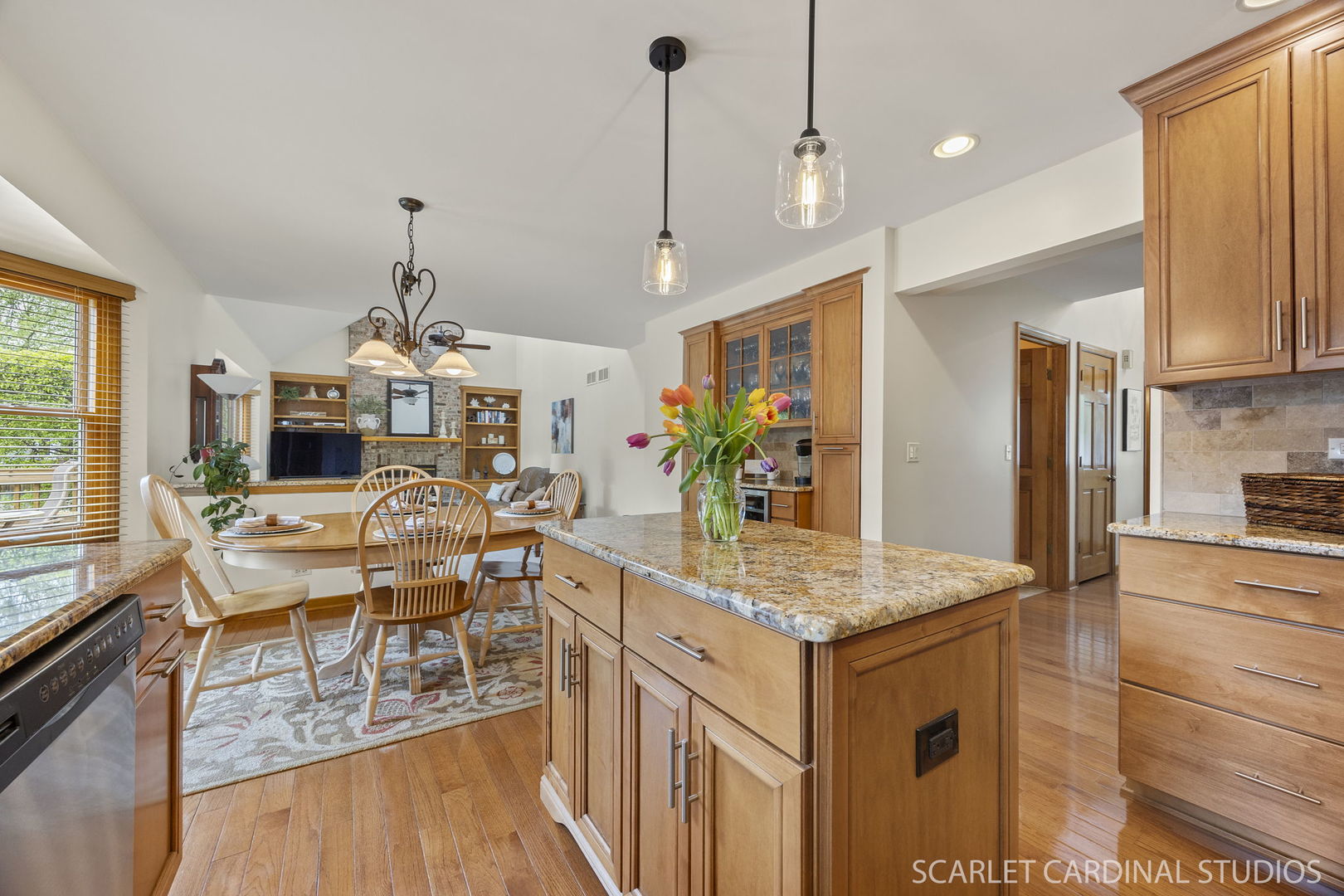 2565 Thornley Court Aurora, IL 60504 - Photo 8 of 59 a living room with stainless steel appliances granite countertop furniture and a wooden floor
