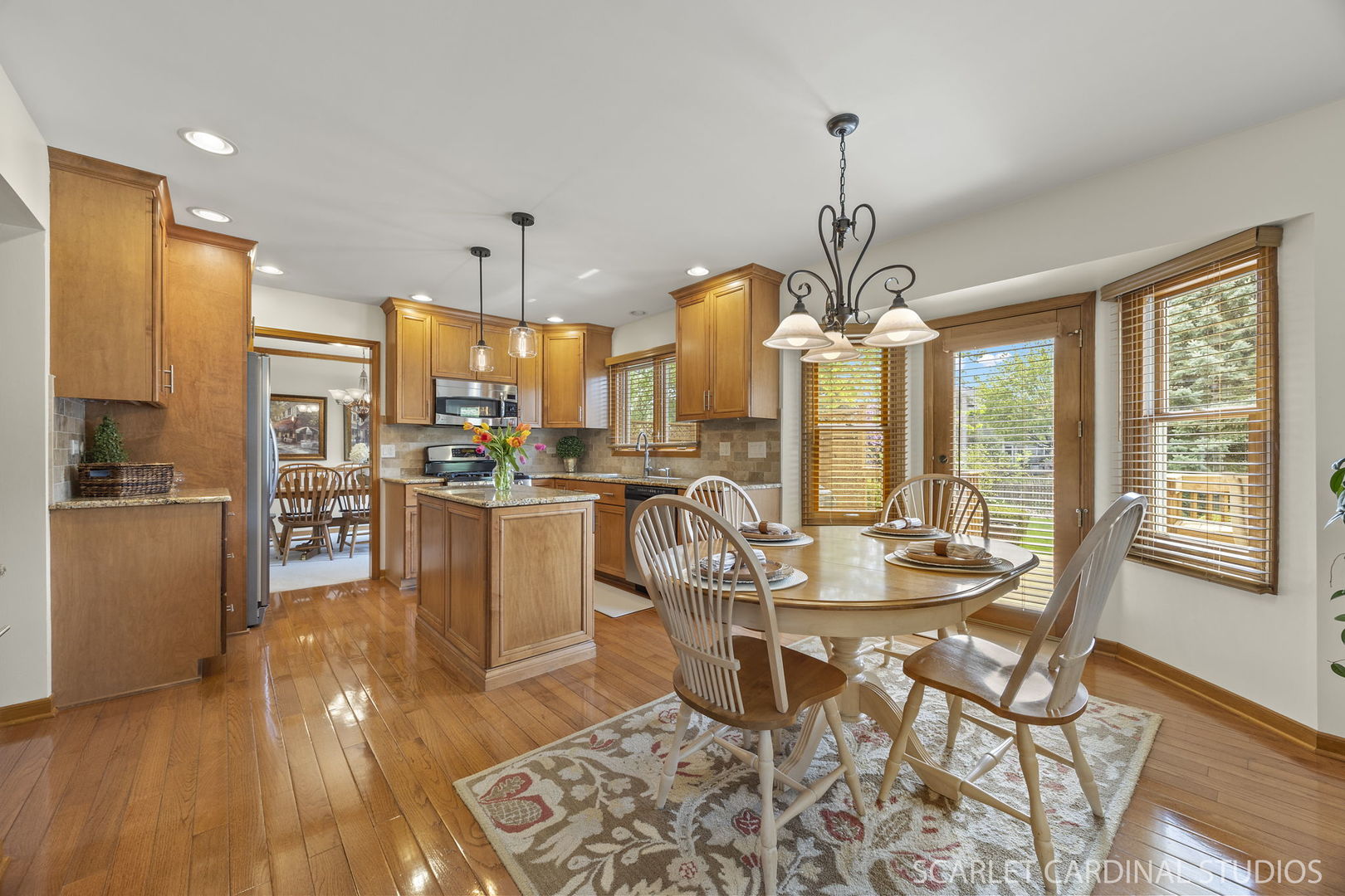 2565 Thornley Court Aurora, IL 60504 - Photo 9 of 59 a view of a dining room with furniture window and wooden floor