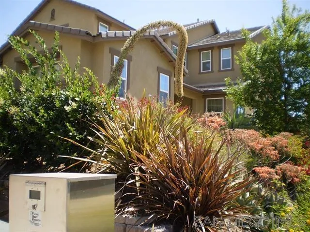 a view of a house with a tree