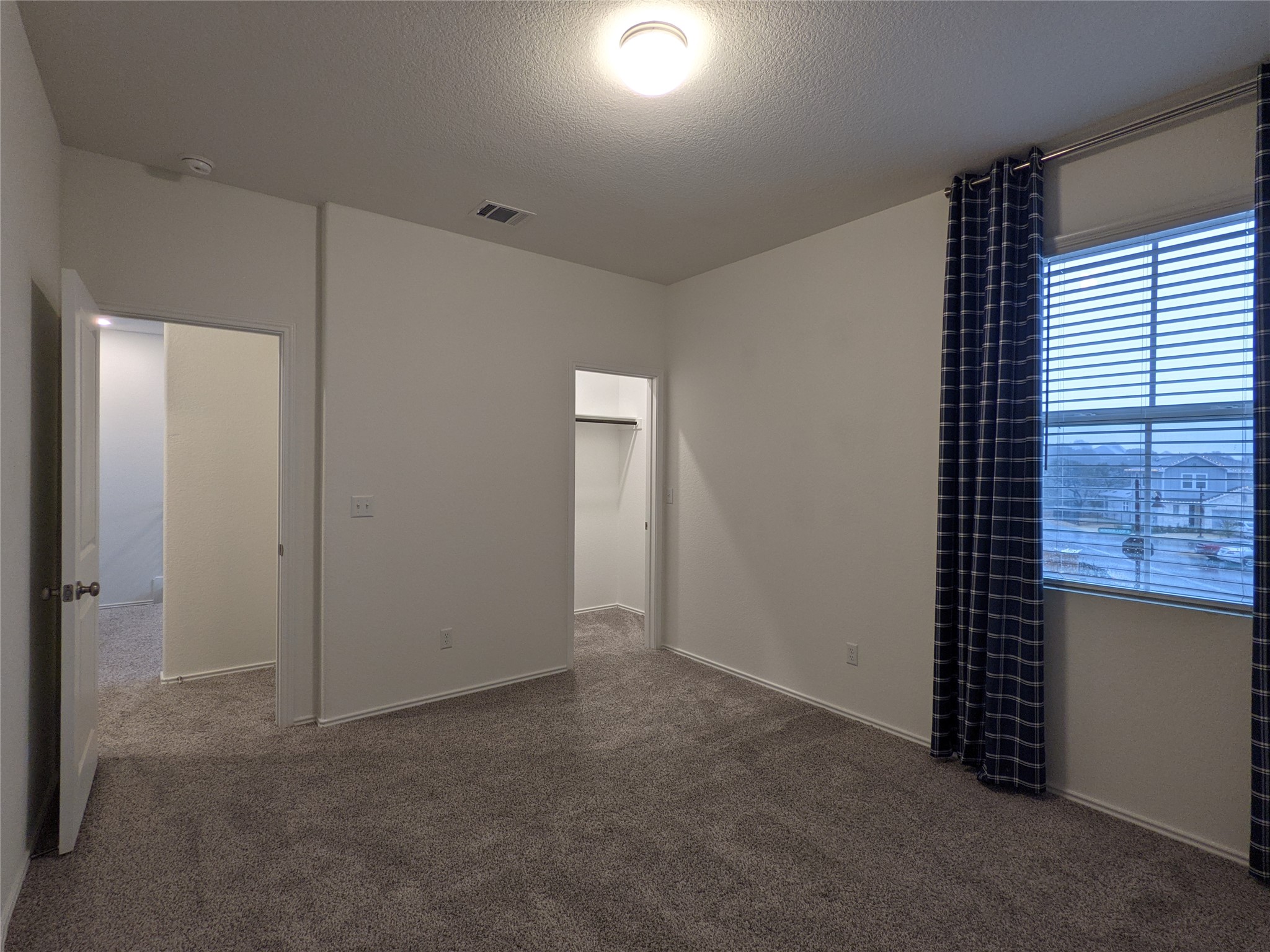 100 Montauk Loop Georgetown, TX 78628 - Photo 12 of 21 A spacious bedroom awaits, offering comfort and tranquility for restful nights.