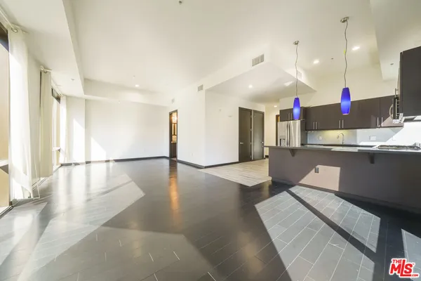 a open kitchen with a refrigerator a sink and a stove