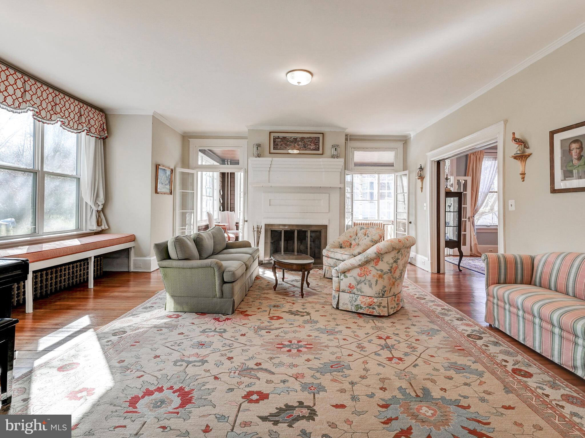 202 Edgevale Road Baltimore, MD 21210 - Photo 7 of 40 Bright and cheery living room with fireplace