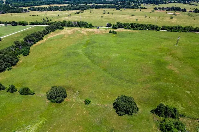 a view of an ocean and residential houses with outdoor space