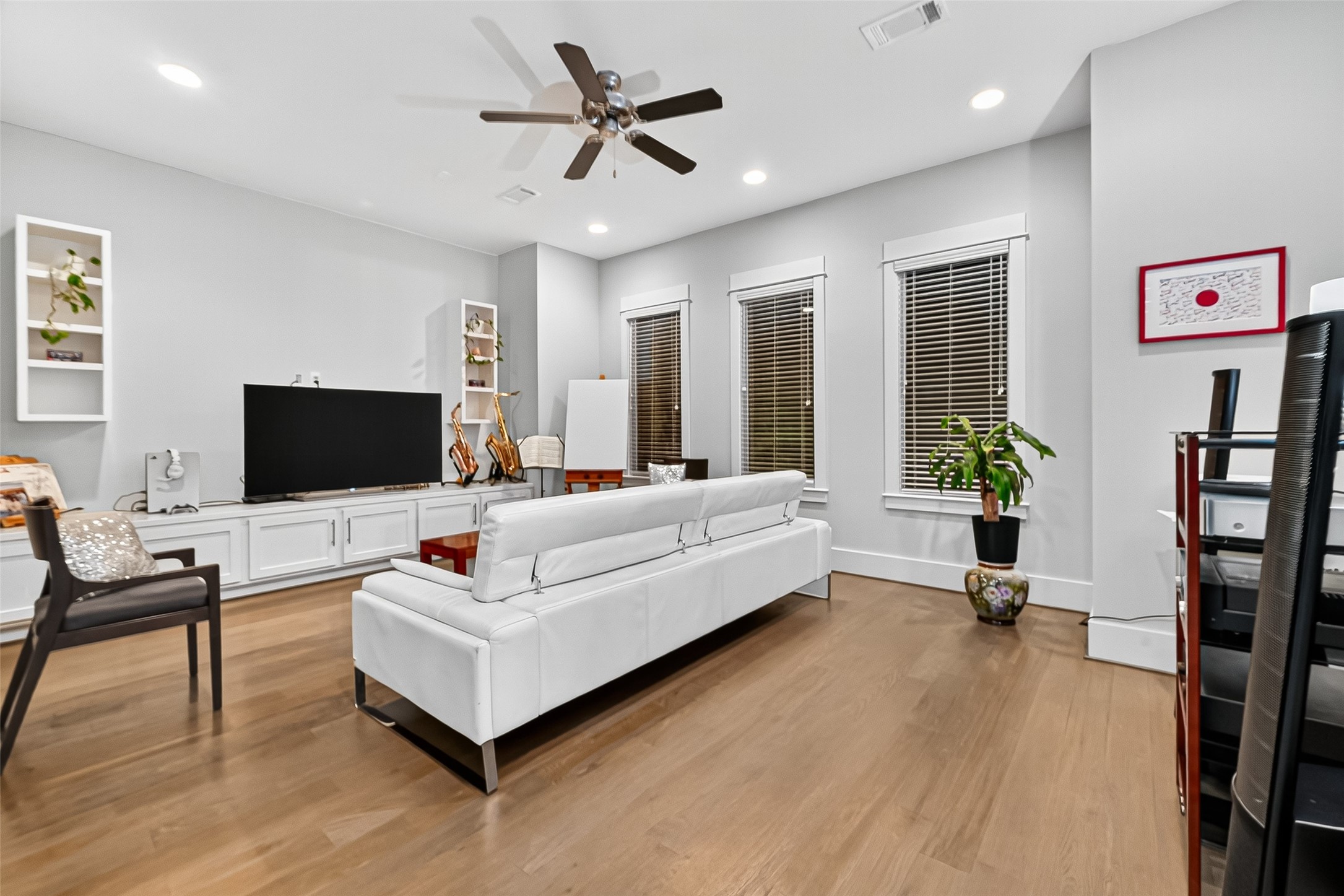 2217 West Main Street Houston, TX 77098 - Photo 17 of 31 a living room with furniture and a flat screen tv