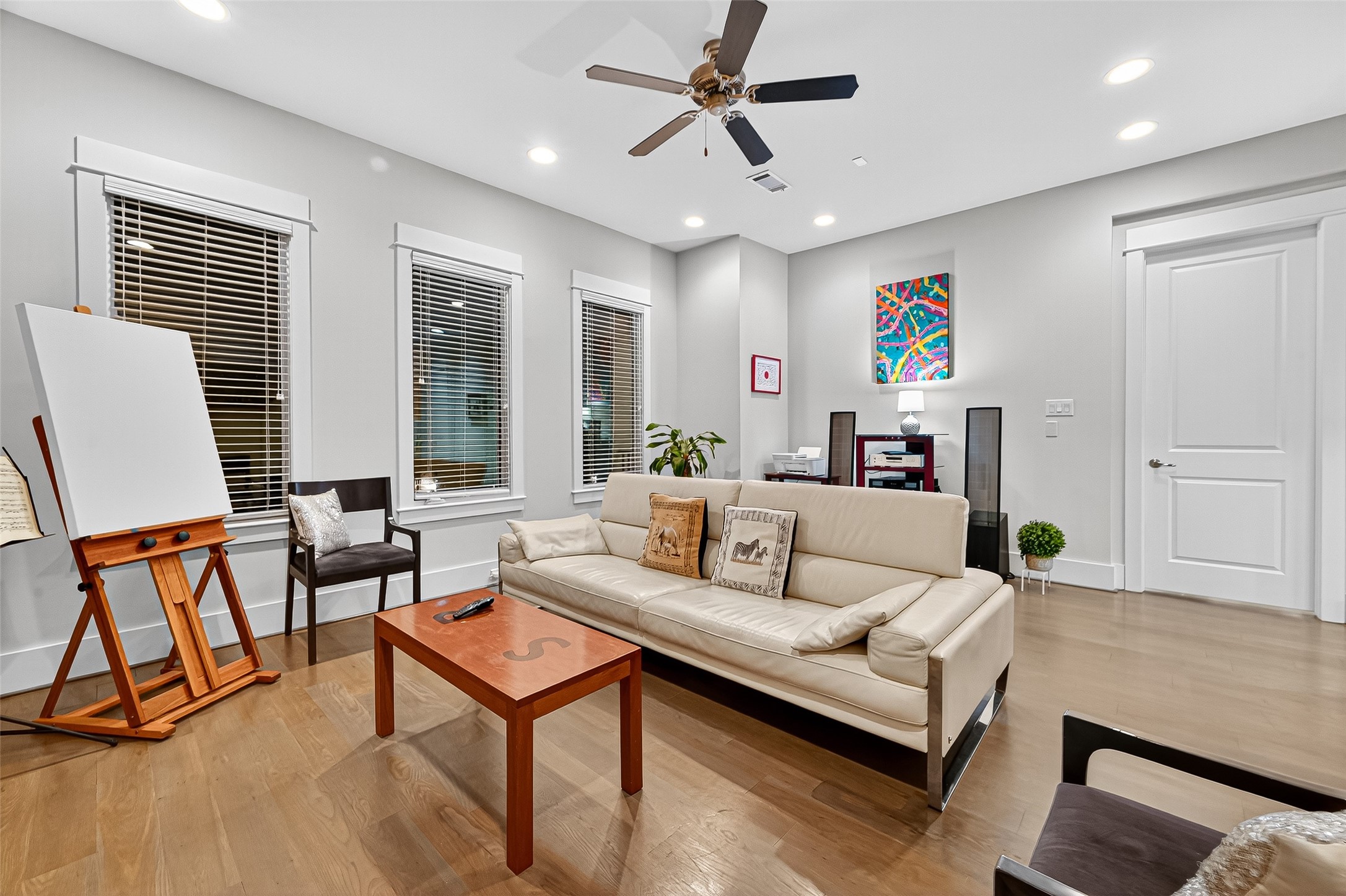 2217 West Main Street Houston, TX 77098 - Photo 18 of 31 a living room with furniture and a flat screen tv