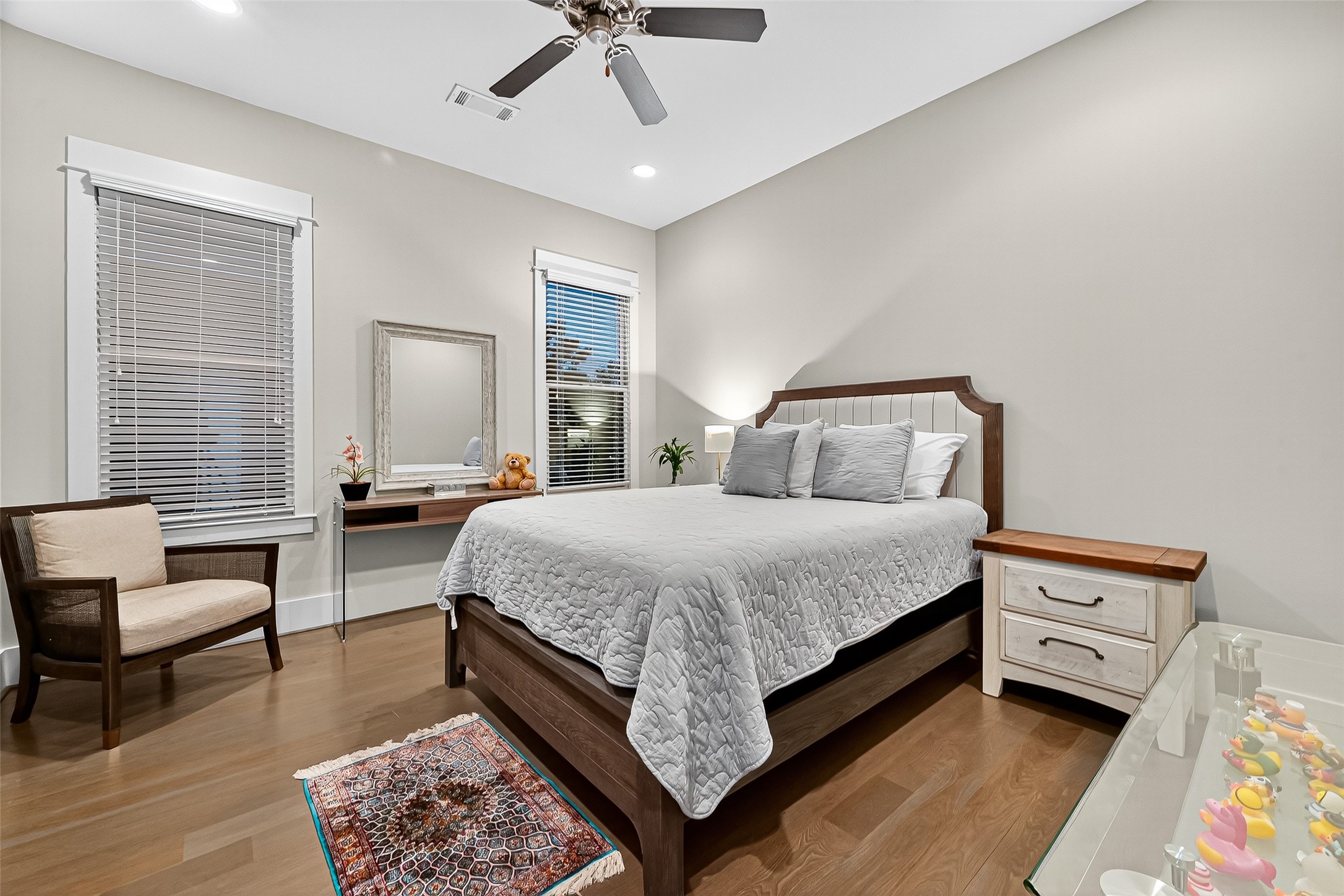 2217 West Main Street Houston, TX 77098 - Photo 22 of 31 a bedroom with a bed a couch and dresser