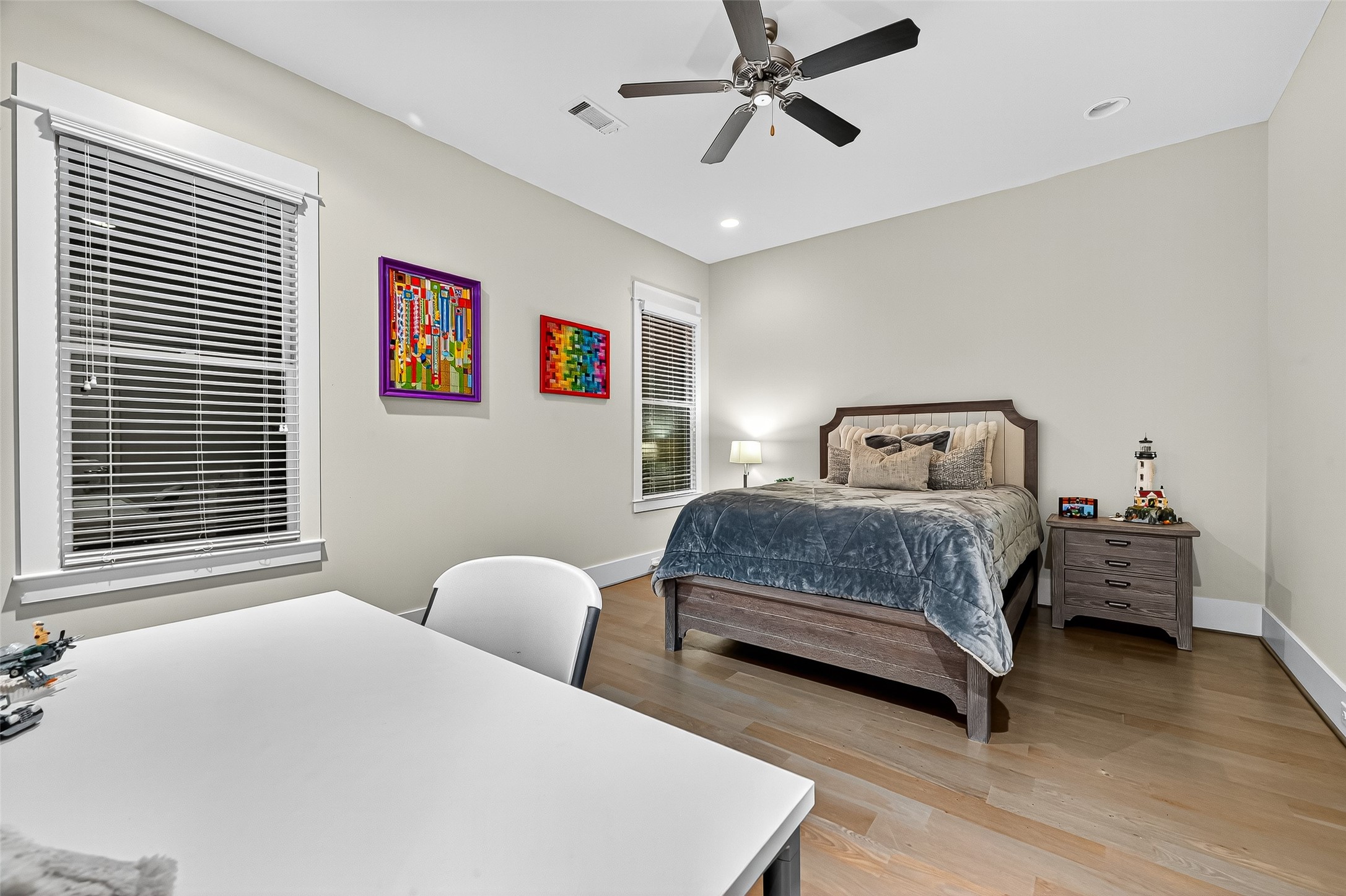 2217 West Main Street Houston, TX 77098 - Photo 24 of 31 a bedroom with a bed and wooden floor