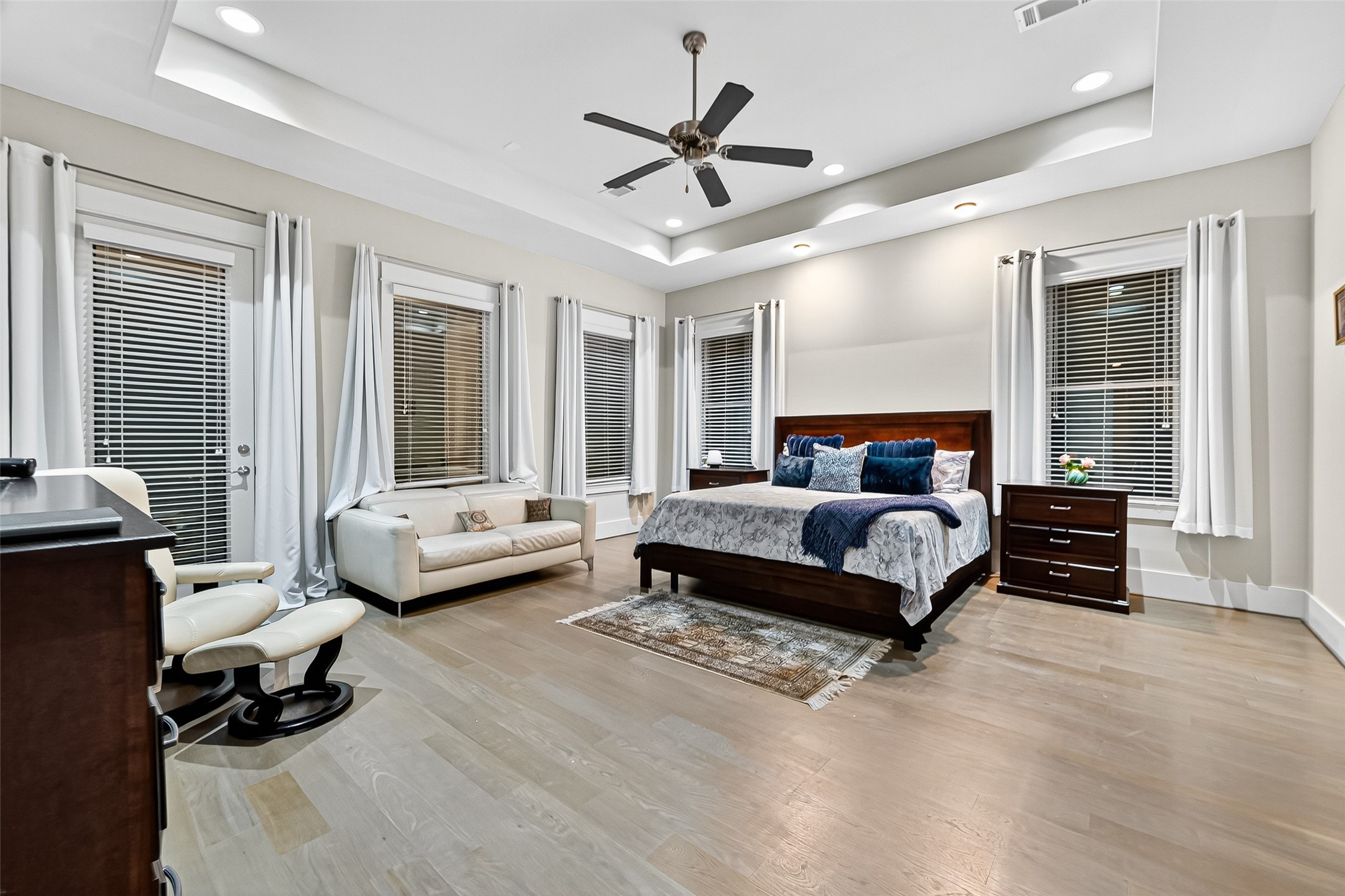 2217 West Main Street Houston, TX 77098 - Photo 3 of 31 a bedroom with a bed couch and a large window