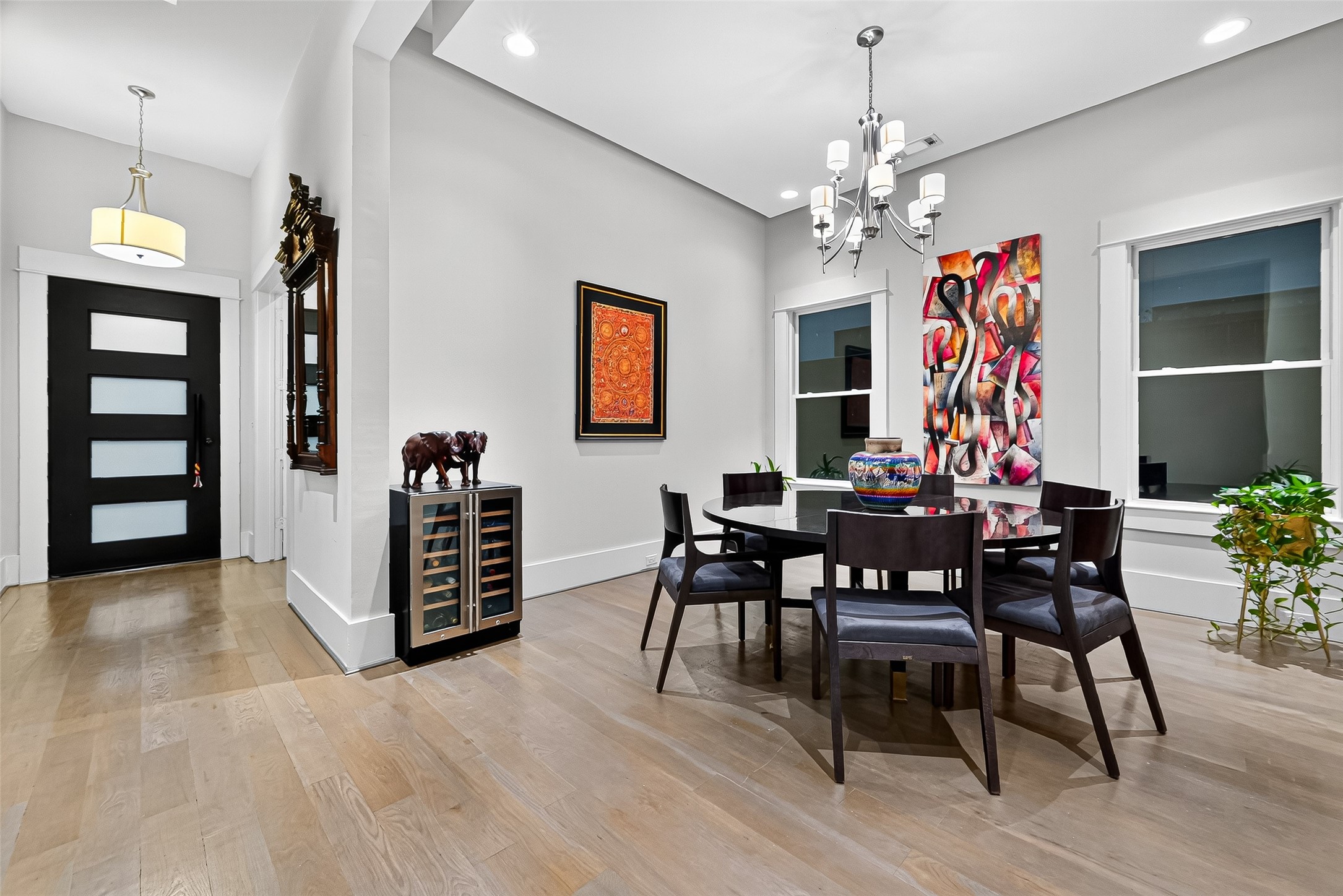 2217 West Main Street Houston, TX 77098 - Photo 8 of 31 a view of a dining room with furniture and chandelier