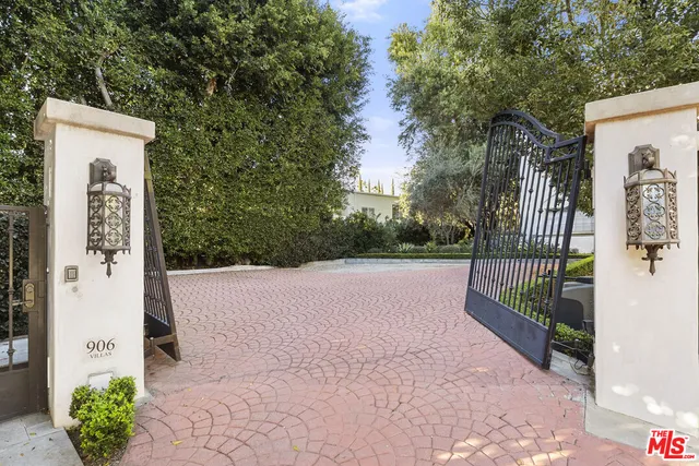 a view of a house with a street