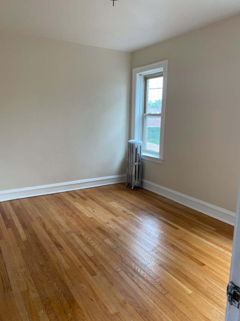 1729 West 91st Street, Unit 2 Chicago, IL 60620 - Photo 7 of 14 a view of a room with wooden floor and windows